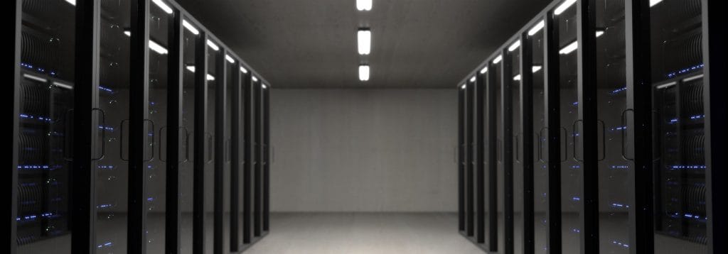 You can see a server room, which is kept dark and contains many servers.