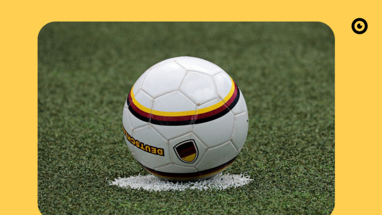 Soccer ball lying on a soccer field.